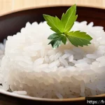 Home 21 스시용 밥 짓는 법 - A close-up, highly detailed image of a bowl of freshly cooked Japanese short-grain sushi rice, showi...
